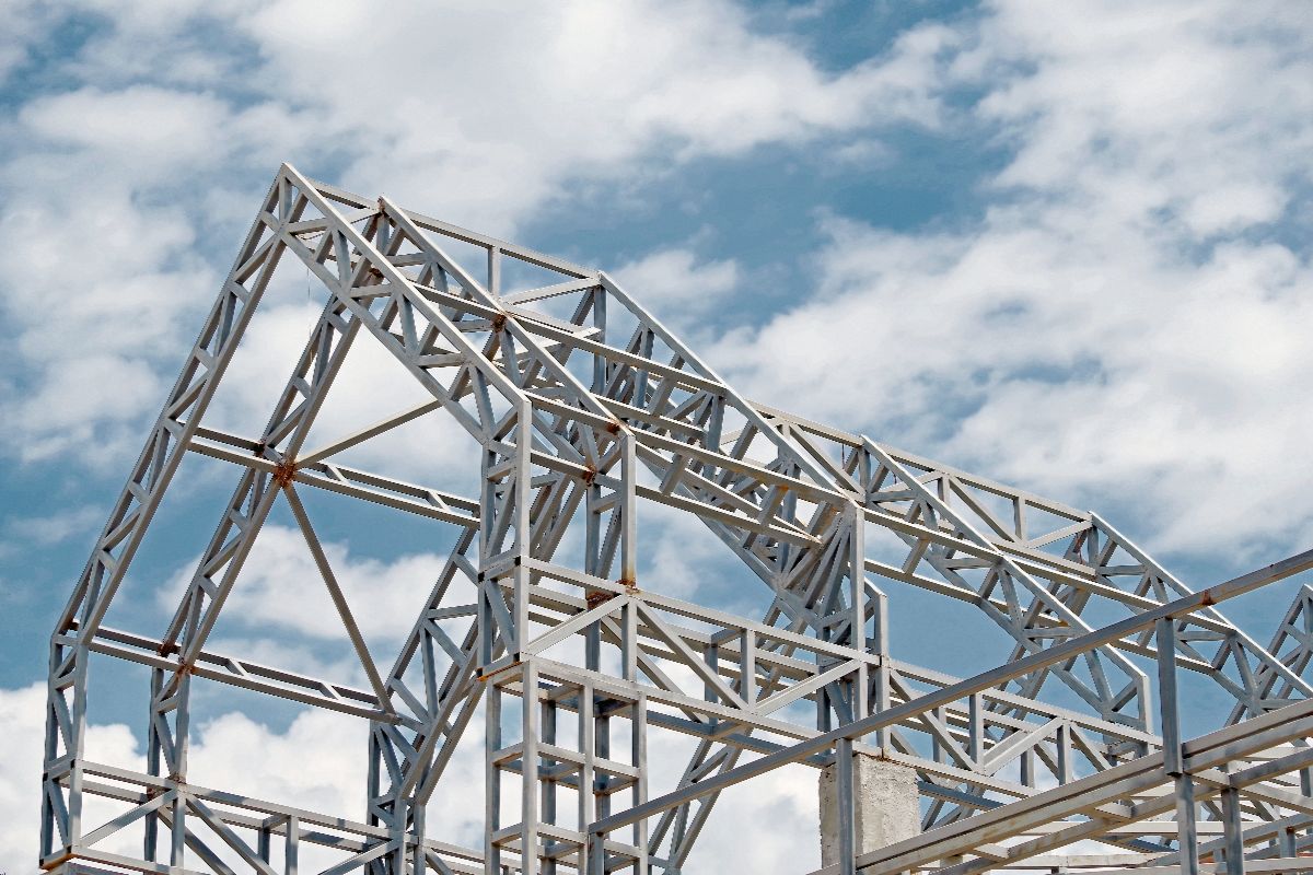 Steel truss framework forming the structural skeleton of a building under construction